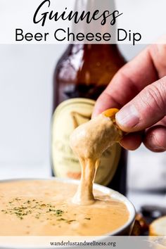 a person dipping cheese into a bowl of beer with the text guinness beer cheese dip