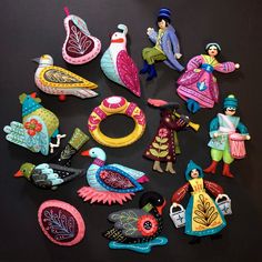 many different toy figurines on a black surface