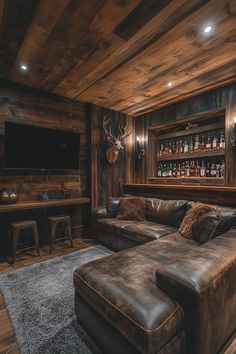 a living room filled with furniture and wooden walls