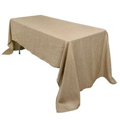 a table covered with a beige cloth