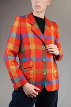 A beautiful rare vintage wool blazer by Renzo with colorful check pattern. Made from pure wool in West-Germany in the 1980s. In mint condition, without any signs of wear.  Size L indicated. The model is 175cm (5.9ft) tall, usually wearing a female size M. The blazer fits well, only slightly big. Recommended for size M-L.  Shoulders: 36 cm ~ 14.17 inches Chest: 49 cm ~ 19.29 inches Sleeve: 62 cm ~ 24.41 inches Length: 67 cm ~ 26.38 inches ... Discount for multiple items, applies automatically at Blazer Fits, Womens Blazers, West Germany, Tartan Plaid, Wool Blazer, Check Pattern, Vintage Wool, Vintage Colors, Blazer Suit