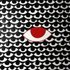 an abstract painting with red and white circles on black background, depicting the eye of a person