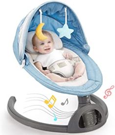 a baby laying in a swing with musical notes on the sides and a moon hanging from it's back