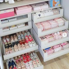 the shelves are filled with baby shoes and diapers for sale in a store or children's room