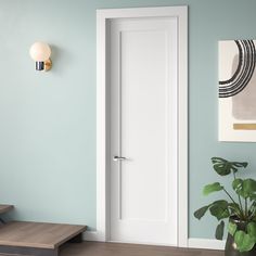 a white door in a blue room next to a wooden step and potted plant