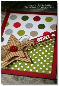 a close up of a christmas card with a star on the front and polka dot background