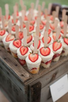 strawberries are arranged on sticks in the shape of hearts