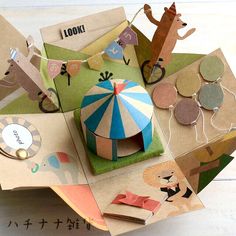 an assortment of paper and craft items on a table