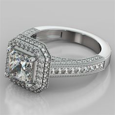 an engagement ring with a princess cut diamond surrounded by pave and round brilliant diamonds