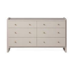 a white dresser with gold knobs on the top and bottom drawers, against a gray background