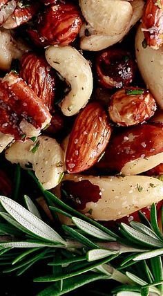 nuts and herbs are mixed together on a plate