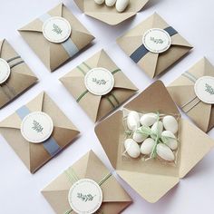 there are many envelopes with small white eggs in them