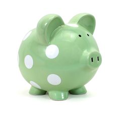 a green piggy bank with white polka dots