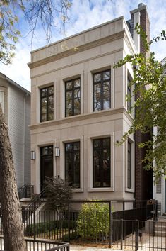 an apartment building with many windows on the front