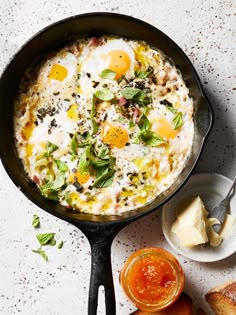 an iron skillet filled with eggs and bread