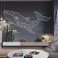 a living room filled with furniture and a large wall mural in the middle of it