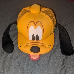 Pluto Hat With Ears From Disney World!! Never Worn, In Great Condition (Nwot) No Reasonable Offer Refused!! Thanks For Shopping My Closet!! Disneyland Hats, Jack Skellington Faces, Mickey Mouse Ears Hat, Disney Gear, Hat With Ears, Disney Yellow, Disney Hats, Logo Yellow, Mickey Mouse Ears