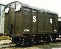 an old train car sitting on the tracks