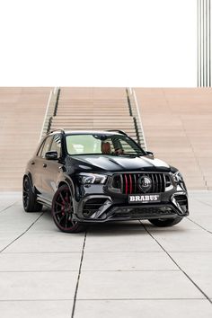 a black car parked in front of some steps