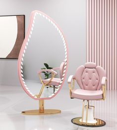 a pink chair sitting next to a mirror on top of a white floor in front of a wall