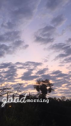 the sky is filled with clouds as the sun goes down in the distance behind it