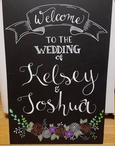 a chalkboard sign that says welcome to the wedding of kelsey and joshua