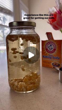 a glass jar filled with food sitting on top of a counter