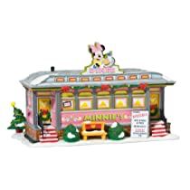 a toy store with mickey mouse on the roof and christmas decorations in front of it