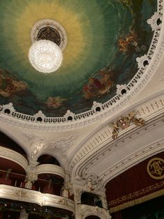 an ornately decorated ceiling in a theatre