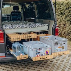 the back end of a van with cargo containers in it