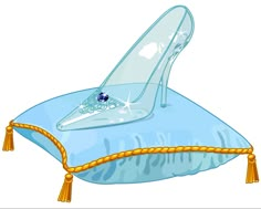 a blue high heeled shoe sitting on top of a pillow