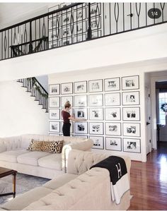 a woman standing in the middle of a living room