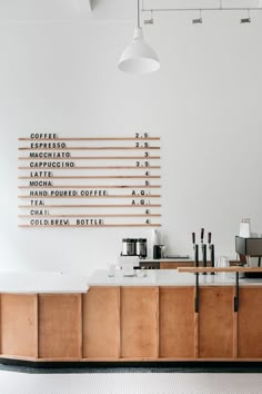 a coffee shop with wooden cabinets and white walls