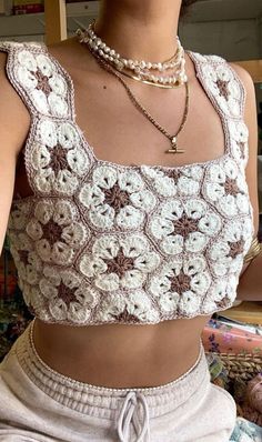 a close up of a person wearing a crop top