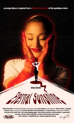 a woman holding her hands up to her face in front of a poster for the film