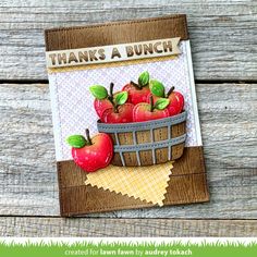 a card with apples in a basket on it