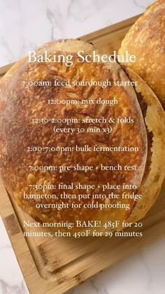 two round breads sitting on top of a cutting board