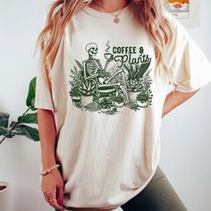 Coffee And Plants Shirt, Skeleton Plant Lover Sweatshirt, Staying Alive T-Shirt Discover Our Newest Collection Of Stylish And Adaptable T-Shirts (Gildan 5000), Where Fashion Meets Comfort! Available In A Wide Range Of Sizes From S To 3xl And Lively Color Choices Including Black, White, Sand, Green, Sport Grey, Red, Navy, And More, Ensuring There's Something For Everyone. Carefully Crafted With Premium Materials, Our T-Shirts Offer A Luxurious Feel And A Snug Fit That Lasts All Day. Engineered To Plant Shirts, Coffee Plant, Lover Sweatshirt, Foods To Eat, Hormone Balancing, Staying Alive, White Sand, Plant Lover, Color Choices