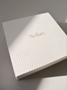 a white box with the word nolan written on it's front and side