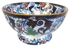 an ornately decorated bowl is shown against a white background