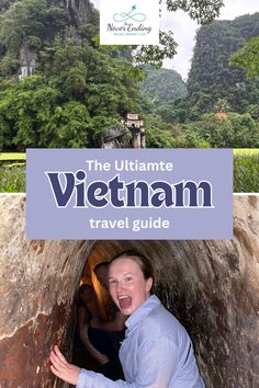 the ultimate vietnam travel guide with an image of a man in a tunnel and text overlay