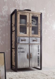 an old fashioned metal cabinet with glass doors