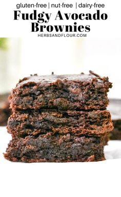 chocolate fudgey avocado brownies stacked up on top of each other