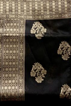 Black Exclusive Beautiful Black Traditional Banarasi Saree, Handloom SarI, Banarasi Silk with Golden Zari Weave Work, Banarasi Silk Saree with rich Pallu, Shipping from USA. Item : Saree Color : Black/Gold Base Fabric : Banarasi Silk Blouse piece : Black and Gold Border Blouse material : Banarasi Silk Saree Length: 5.5 Meter , Blouse Length: 0.8 Meter Occasion: Party, Wedding, Festival, Wedding, Traditional, Religious, House-warming, Social Gatherings and Celebrations. Saree comes with unstitched blouse piece, Stitching service is available. We provide Fall, Pico and blouse stitching with Additional charge Please check carefully when you order. Blouse Stitching :custom size Blouse please provide your measurements fallow the last picture. SHIPPING TIME: This product will be shipped to you w Black Traditional Wear With Zari Weaving, Traditional Black Wear With Zari Weaving, Bollywood Black Dupatta With Self Design, Black Bollywood Style Dupatta With Self Design, Black Sets With Pallu For Festivals, Black Banarasi Silk Traditional Wear With Self Design, Black Banarasi Silk Blouse For Traditional Ceremonies, Black Banarasi Silk Traditional Wear, Black Dupatta With Self Design For Festivals