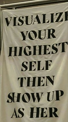 a sign that says visualize your highest self then show up as her