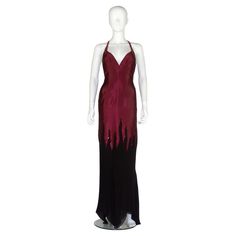 Vintage Thierry Mugler couture dress, in wine red/deep purple liquid silk, with a black chiffon hem detailed with a glass beaded flame tip design. Circa 2000. This is the exact dress worn by the singer Raye, who wore it to her performance at the Hilton London where she performed her single Genesis. Condition Very good Approximate Measurements No size tag Bust: 32-34" Waist: 29-30" Length (excluding straps): 56.5" Please note the garment has been clipped on the mannequin for display purposes, ple Thierry Mugler Designer, Thierry Mugler Gown, Vintage Mugler Dress, Mugler Vampire Dress, Thierry Mugler Flower Dress, Deep Purple Dress, Thierry Mugler Red Dress, Thierry Mugler, Vestidos Vintage