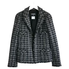 Stunning Chanel houndstooth tweed jacket from the Fall 2007 07A - collection. Worn once and comes with spare button/fabric swatch. Made from super soft 90% cashmere navy and grey check tweed with raw edged detailing. It has a semi tailored, open fronted cut with wide lapels, 4 button up pockets, half belt to back, lightly padded shoulders and 3 button cuffs. Buttons are metal, enamel and glitter resin. Has camellia silk lining with chain weight to hem. Size FR34/UK6 and will fit a size larger as Channel Coat, Chanel Houndstooth, Navy Chanel, Fabric Swatch, Gray Silk, Silk Jacket, Double Breasted Jacket, Fabric Swatches, Tweed Jacket