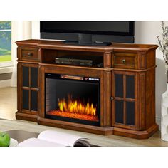 an entertainment center with a fireplace in it