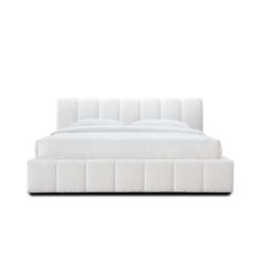 a bed with white sheets and pillows on top of it, in front of a white wall