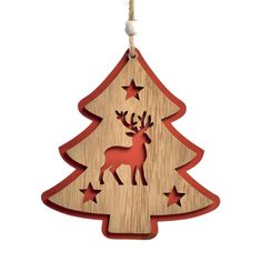 a wooden ornament with an image of a christmas tree and stars on it